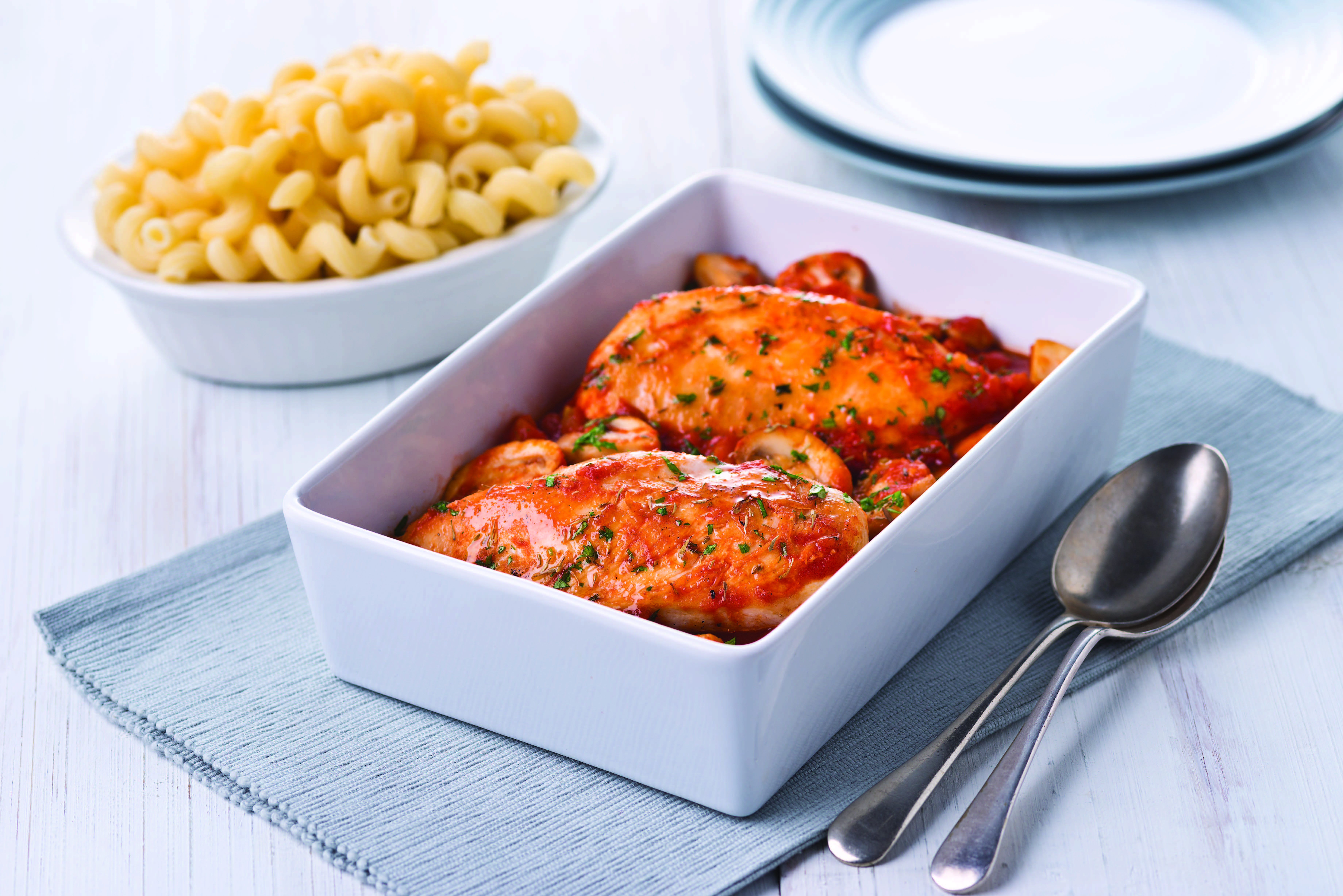 A dish of Easy Italian Chicken served with pasta
