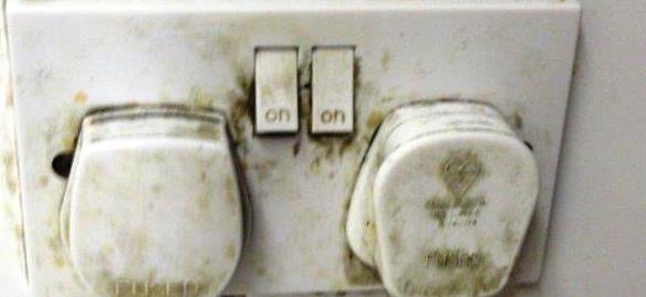 Image of dirty wall sockets with plugs